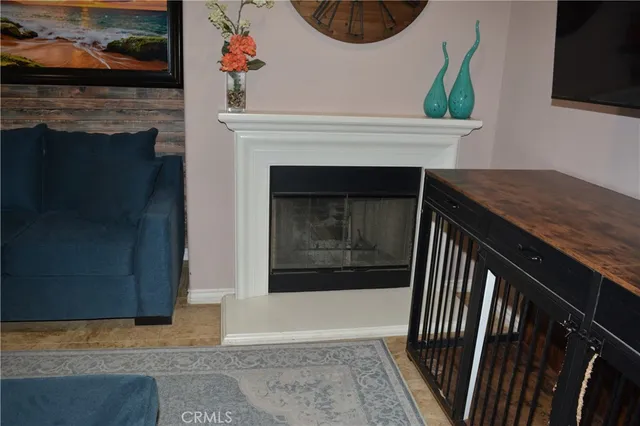 a view of a livingroom with furniture and a fireplace
