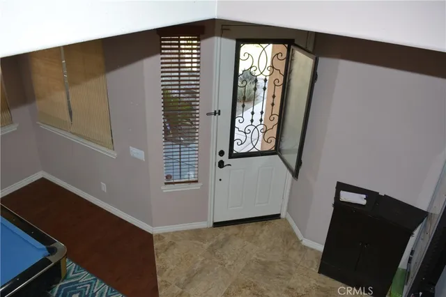 a view of a hallway with windows