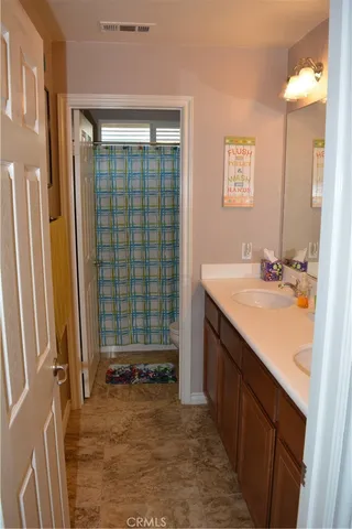 a bathroom with a sink a vanity and a mirror