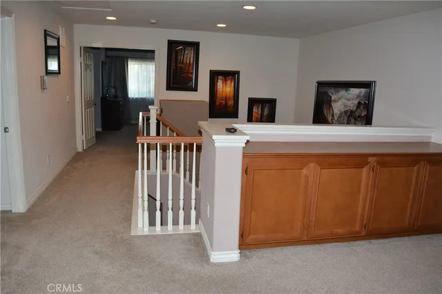a bedroom with furniture and a flat screen tv