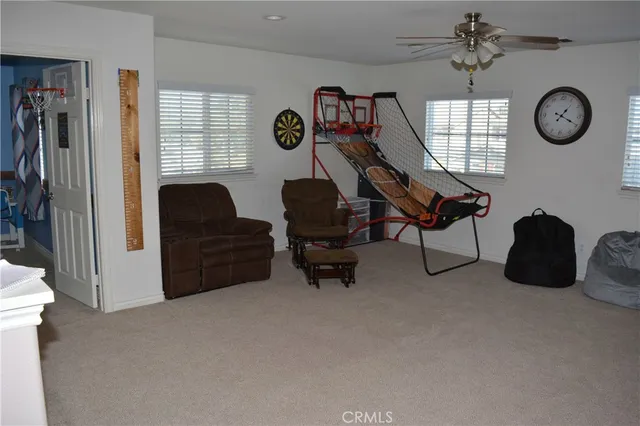 a view of workspace with furniture and a window