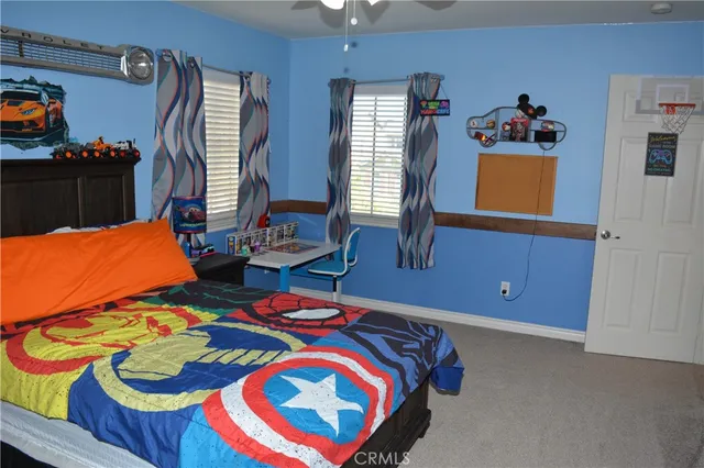 a bedroom with a bed and window