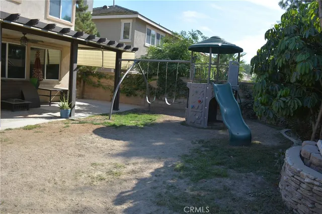 a view of backyard with wheel chair and potted plants