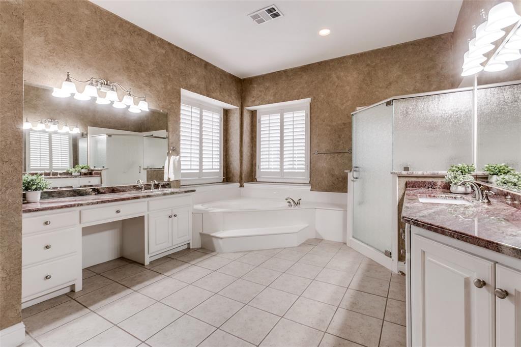 6027 Rathbone Drive Parker, TX 75002 - Photo 19 of 39 a spacious bathroom with a granite countertop sink mirror and a bathtub