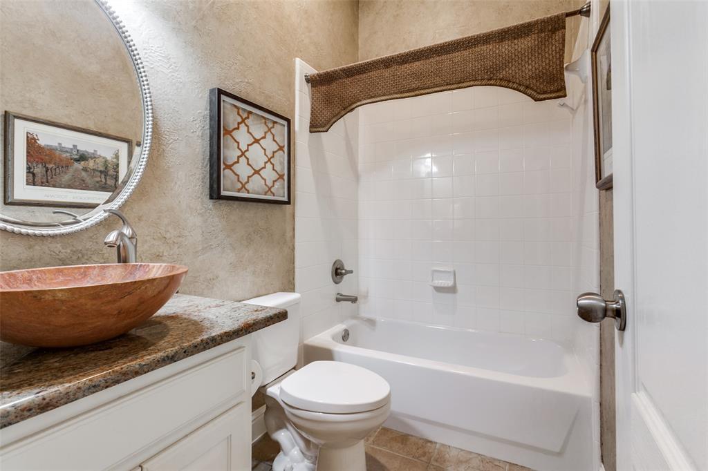 6027 Rathbone Drive Parker, TX 75002 - Photo 23 of 39 a bath room with a toilet and a bathtub