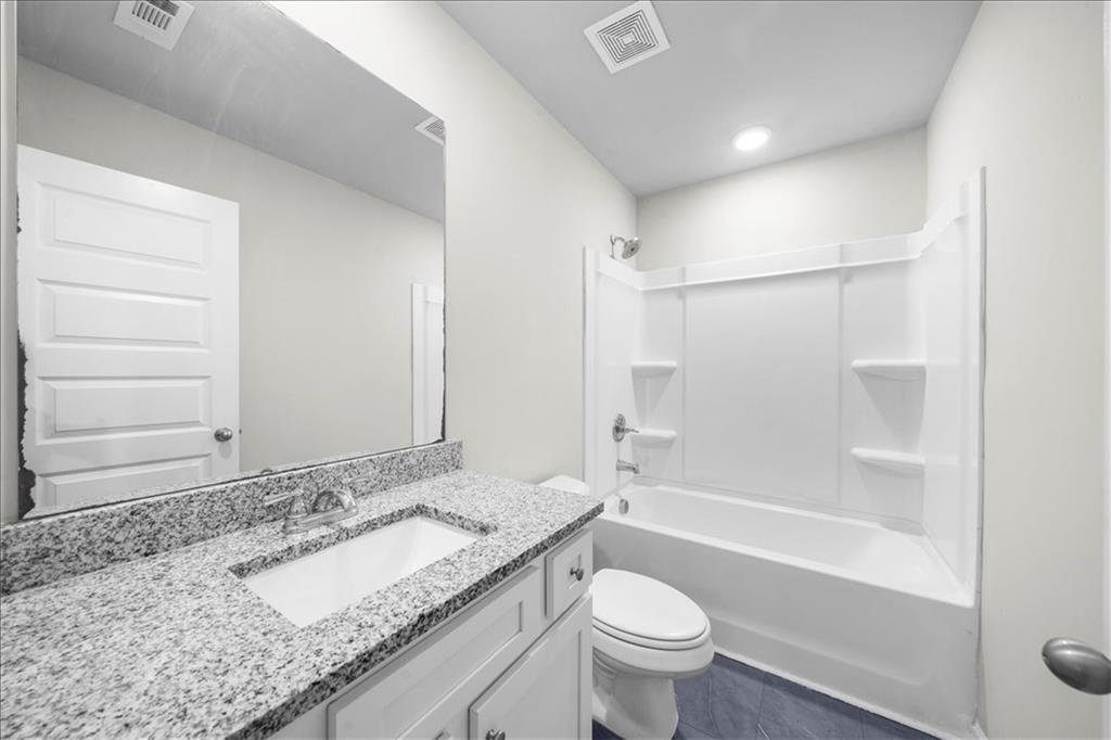 300 Harrison Street Calhoun, GA 30701 - Photo 7 of 17 a bathroom with a granite countertop sink toilet and shower