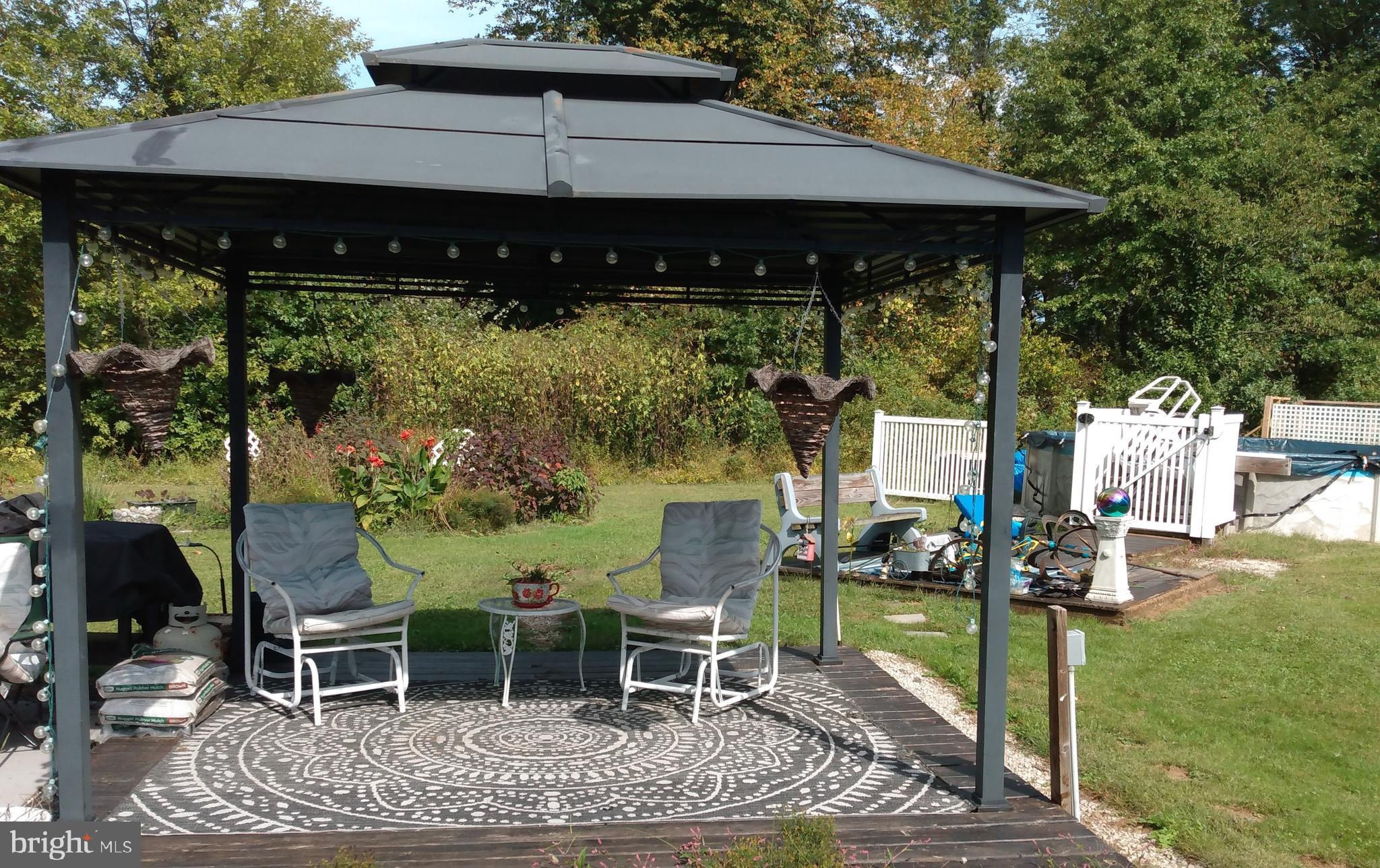 2175 Telegraph Road Rising Sun, MD 21911 - Photo 11 of 14 a view of a patio with table and chairs under an umbrella