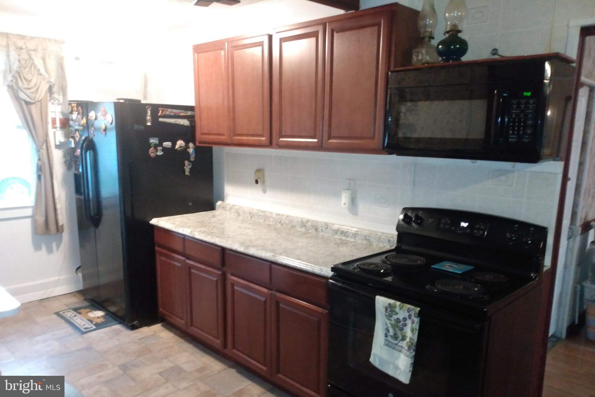 2175 Telegraph Road Rising Sun, MD 21911 - Photo 3 of 14 a kitchen with a sink and cabinets