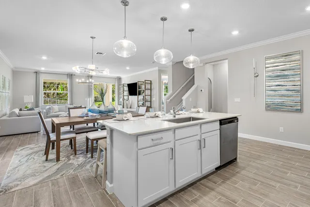 a large kitchen with lots of counter space and a sink