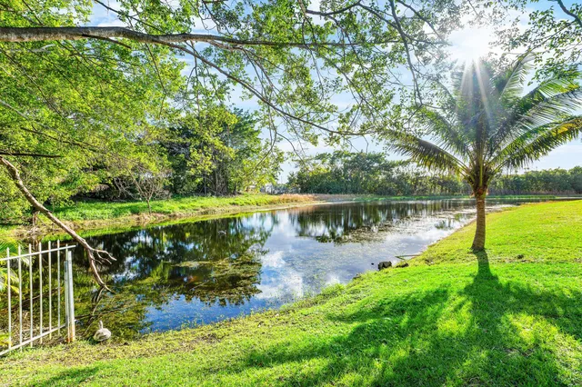 a view of a lake with houses in the back