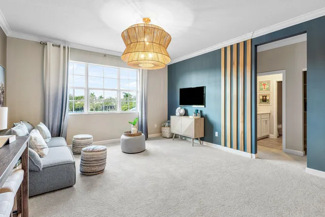 a view of a livingroom with furniture and a chandelier