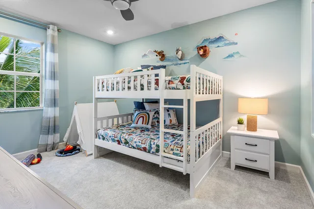 a view of a bedroom with furniture