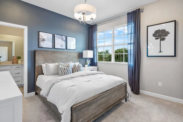 a bedroom with bed and window