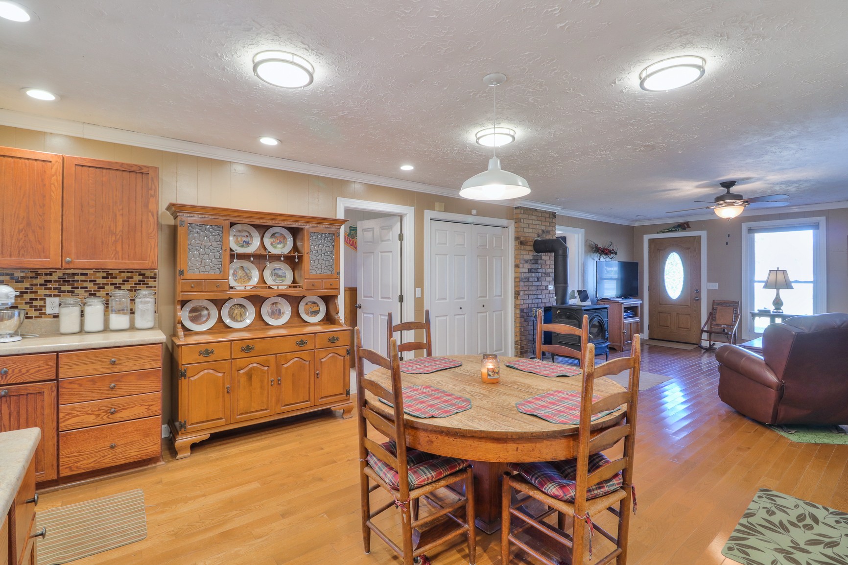 1824 Logue Road Mount Juliet, TN 37122 - Photo 12 of 53 a living room with stainless steel appliances kitchen island granite countertop furniture and wooden floor