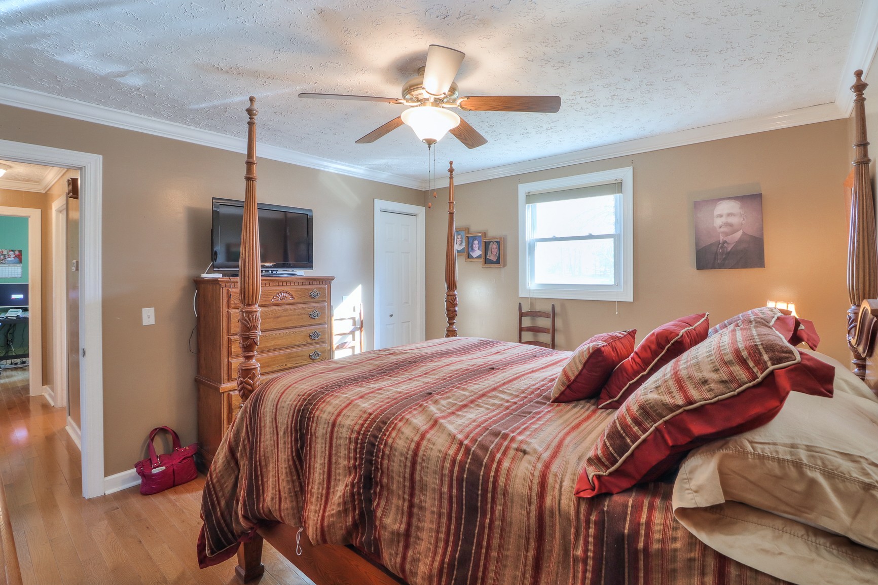 1824 Logue Road Mount Juliet, TN 37122 - Photo 14 of 53 a bedroom with a bed and a chandelier