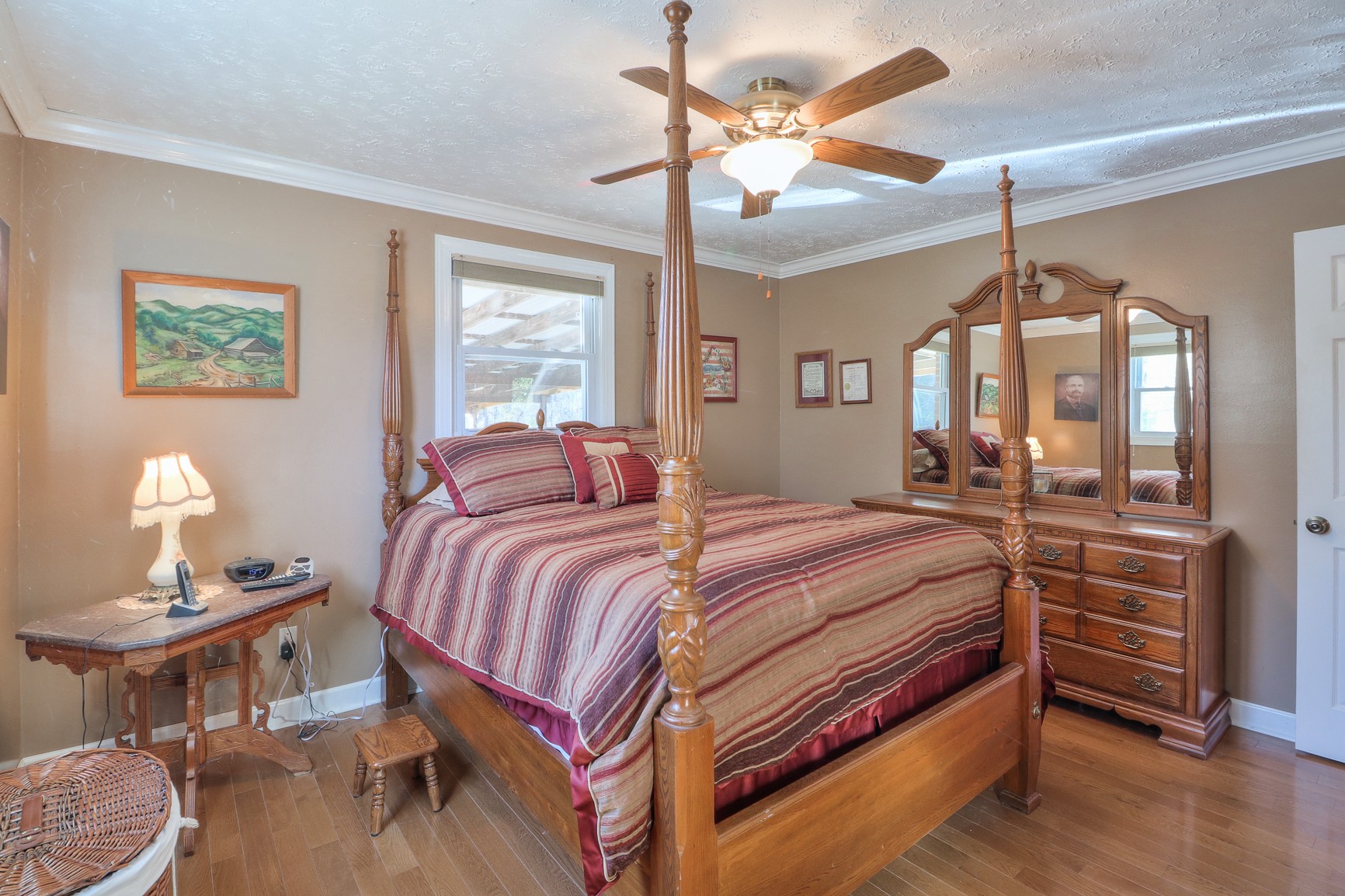 1824 Logue Road Mount Juliet, TN 37122 - Photo 15 of 53 a bedroom with a bed a chandelier and a mirror on the dresser