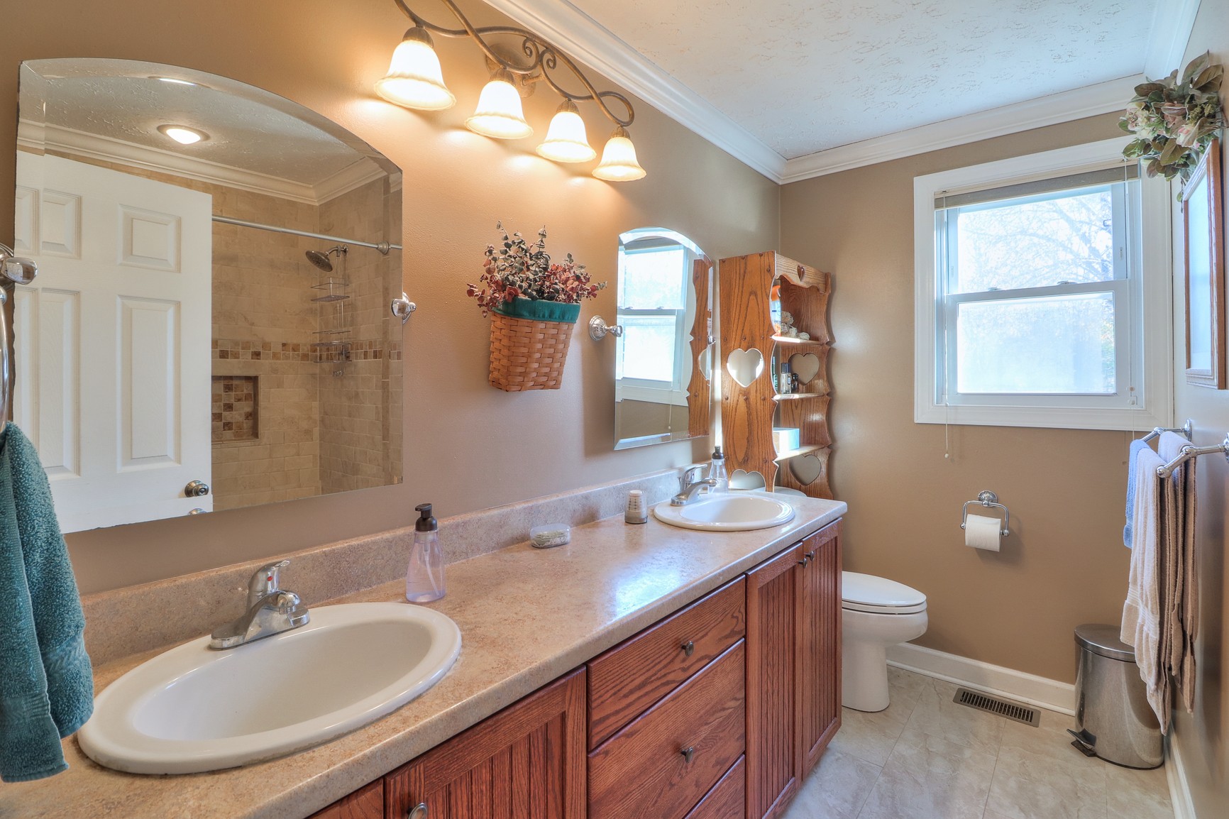 1824 Logue Road Mount Juliet, TN 37122 - Photo 17 of 53 a bathroom with a double vanity sink toilet and a mirror