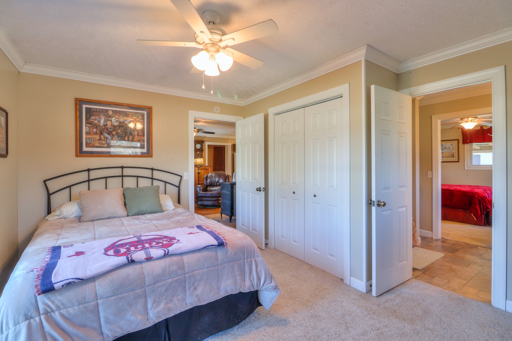 1824 Logue Road Mount Juliet, TN 37122 - Photo 24 of 53 a bedroom with a large bed and a chandelier