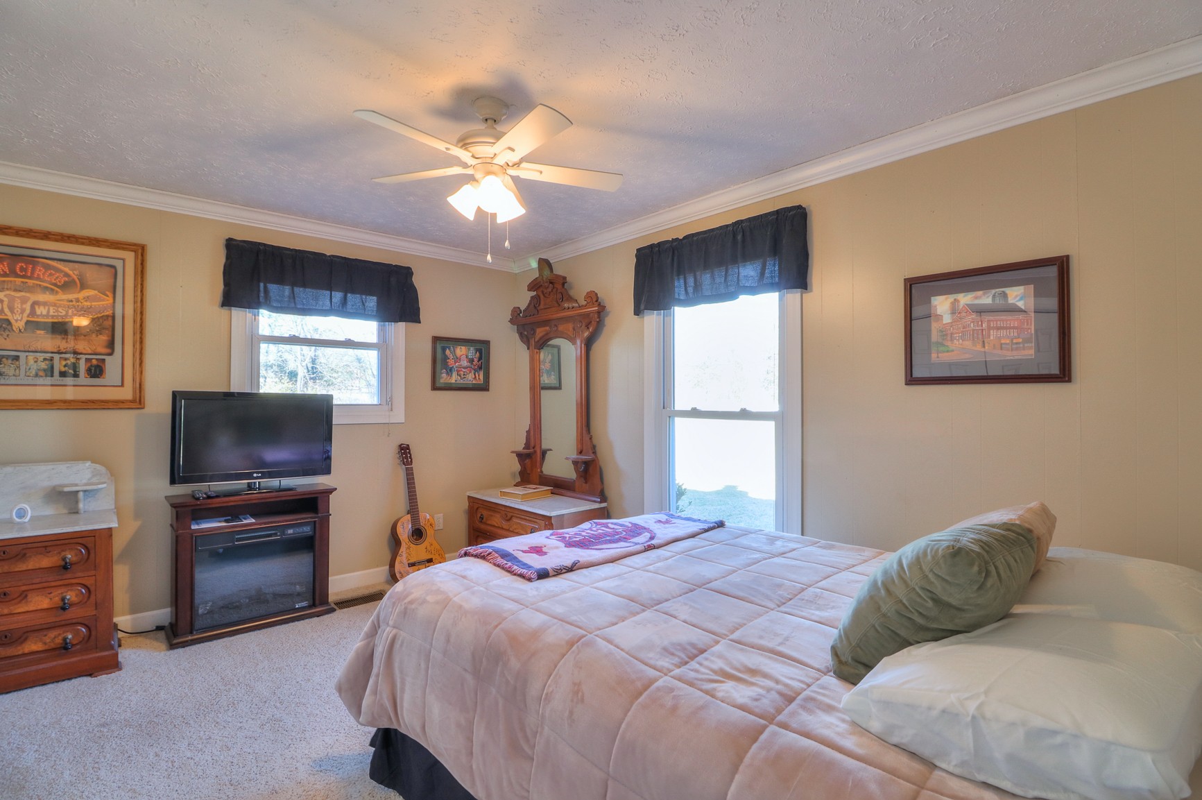 1824 Logue Road Mount Juliet, TN 37122 - Photo 25 of 53 a bedroom with a bed dresser and a flat tv screen