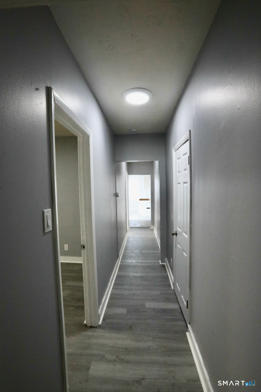 156 Poplar Street, Unit 1 New Haven, CT 06513 - Photo 12 of 31 a view of hallway with wooden floor