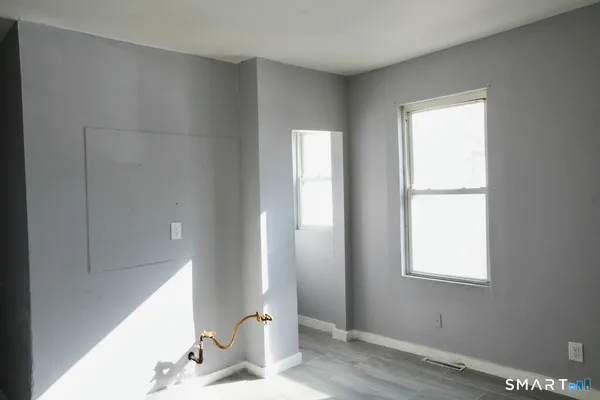 a bathroom with a window sink and vanity