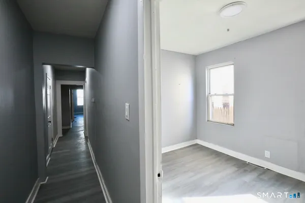 a view of a hallway with a window