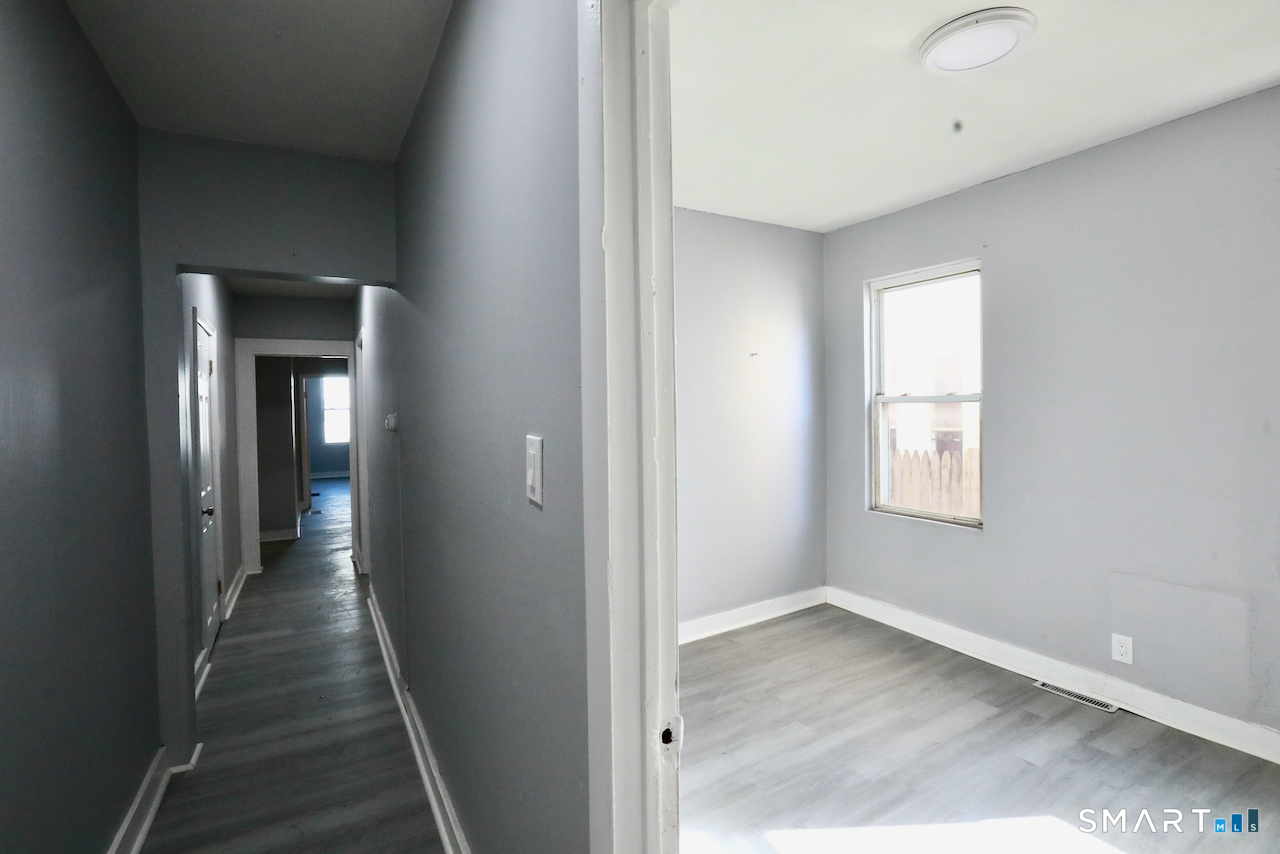 156 Poplar Street, Unit 1 New Haven, CT 06513 - Photo 30 of 31 a view of a hallway with a window