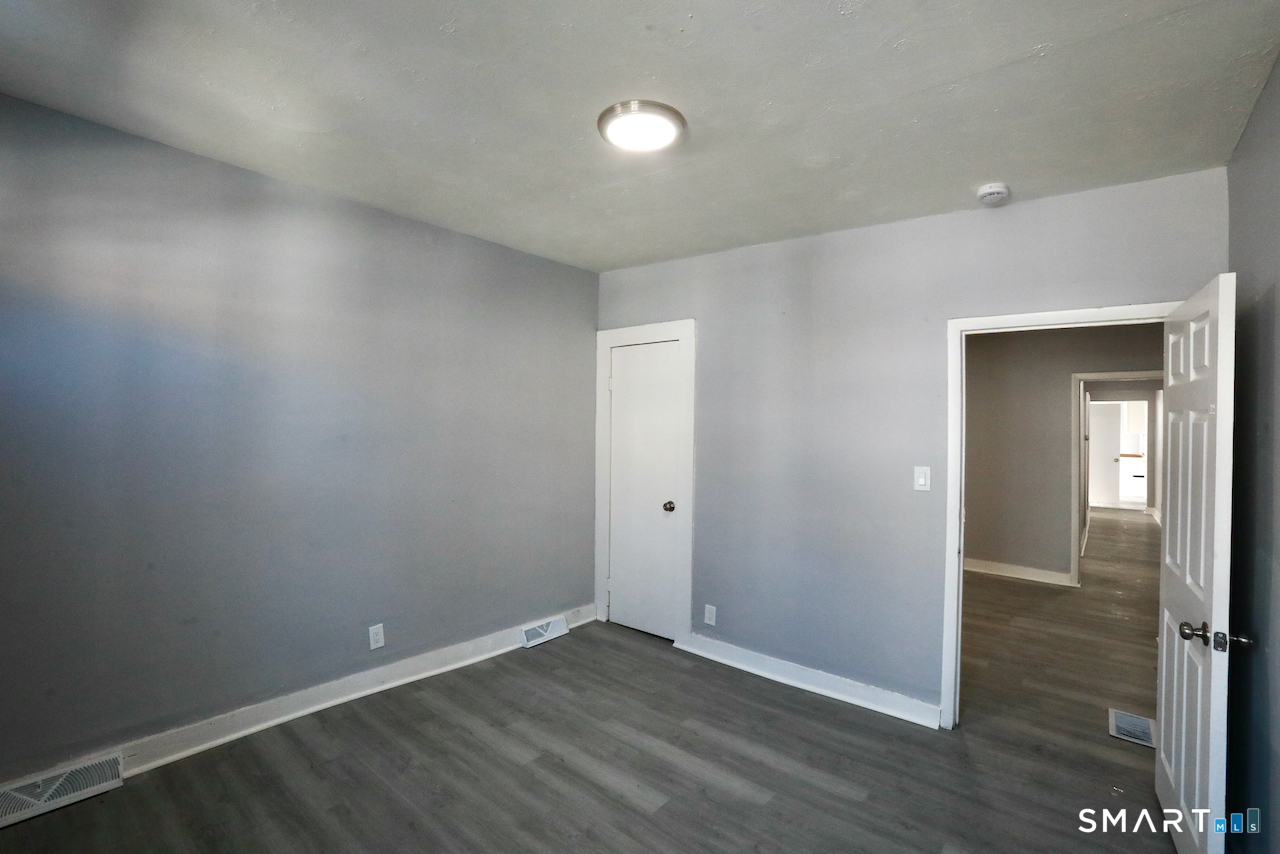 156 Poplar Street, Unit 1 New Haven, CT 06513 - Photo 6 of 31 wooden floor in an empty room