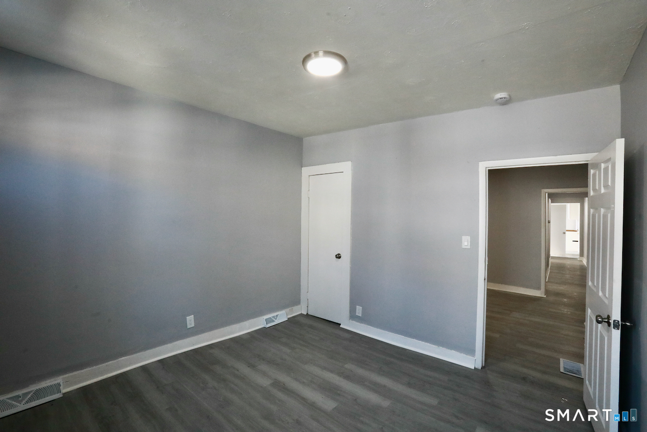156 Poplar Street, Unit 1 New Haven, CT 06513 - Photo 7 of 31 wooden floor in an empty room