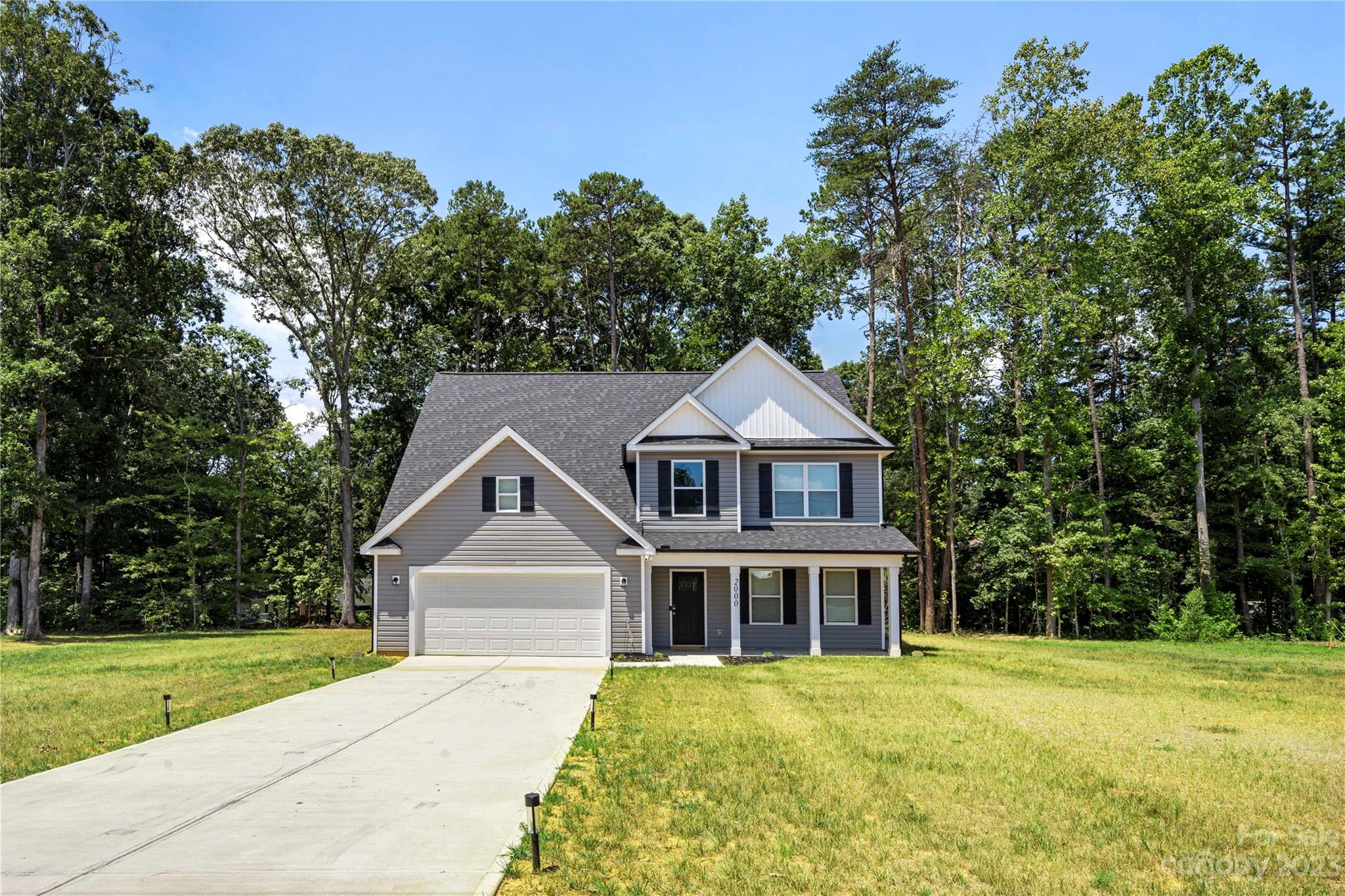 2000 Stirewalt Road China Grove, NC 28023 - Photo 2 of 43 front view of a house with a yard
