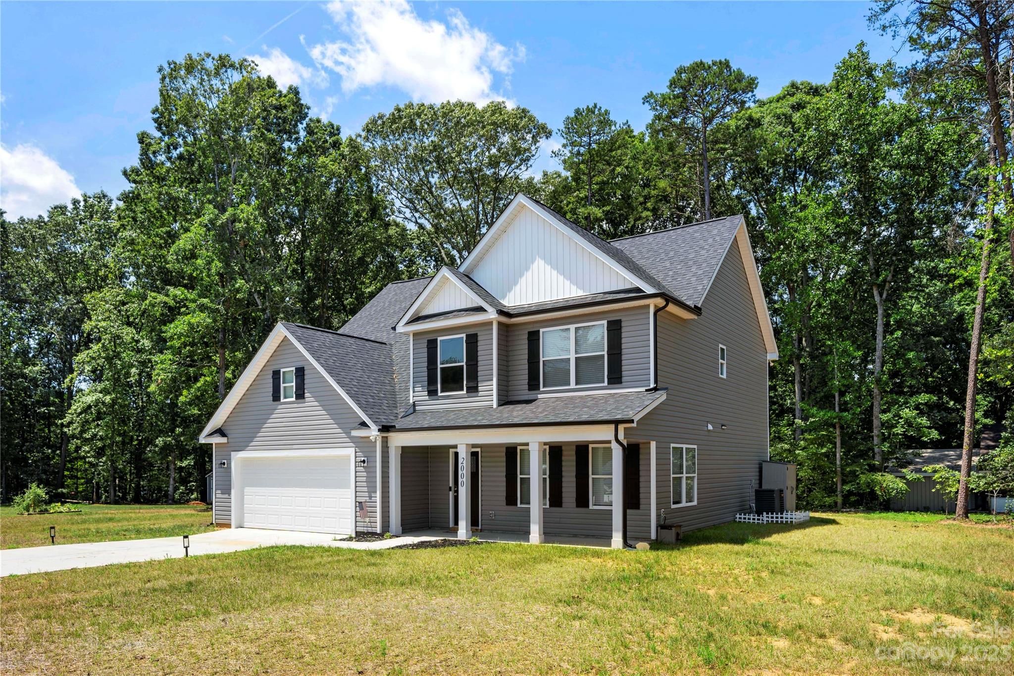 2000 Stirewalt Road China Grove, NC 28023 - Photo 3 of 43 a front view of a house with a garden