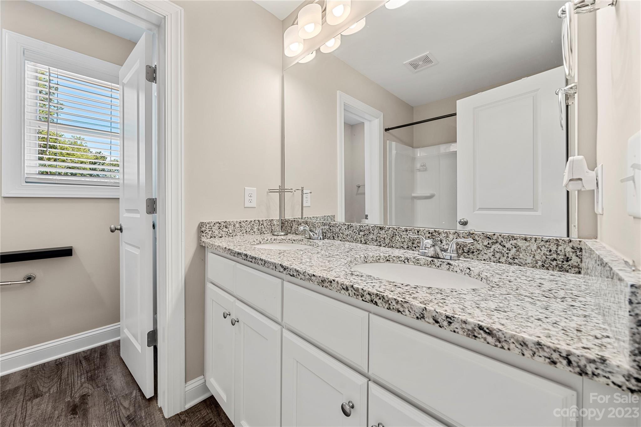2000 Stirewalt Road China Grove, NC 28023 - Photo 35 of 43 a bathroom with a granite countertop sink and a mirror