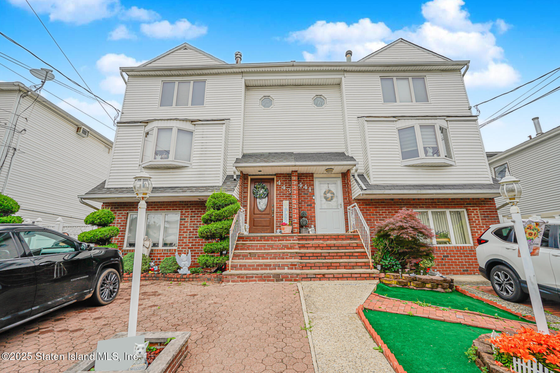 443 Ridgewood Avenue Staten Island, NY 10312 - Photo 1 of 26 a front view of a house with garden