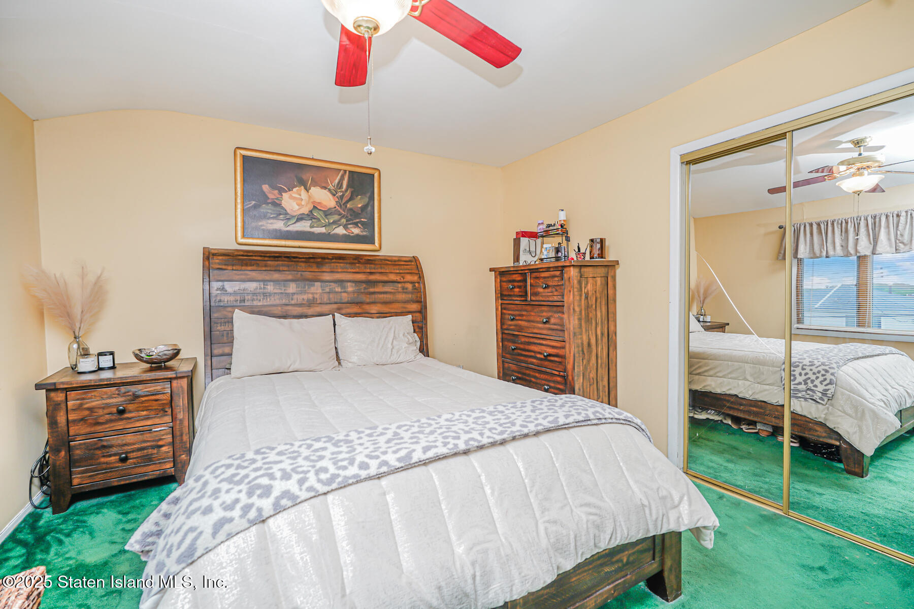 443 Ridgewood Avenue Staten Island, NY 10312 - Photo 14 of 26 a bedroom with a bed and a dresser