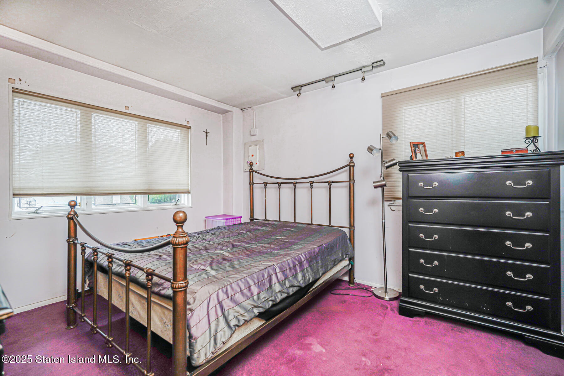 443 Ridgewood Avenue Staten Island, NY 10312 - Photo 16 of 26 a bedroom with a bed and a dresser