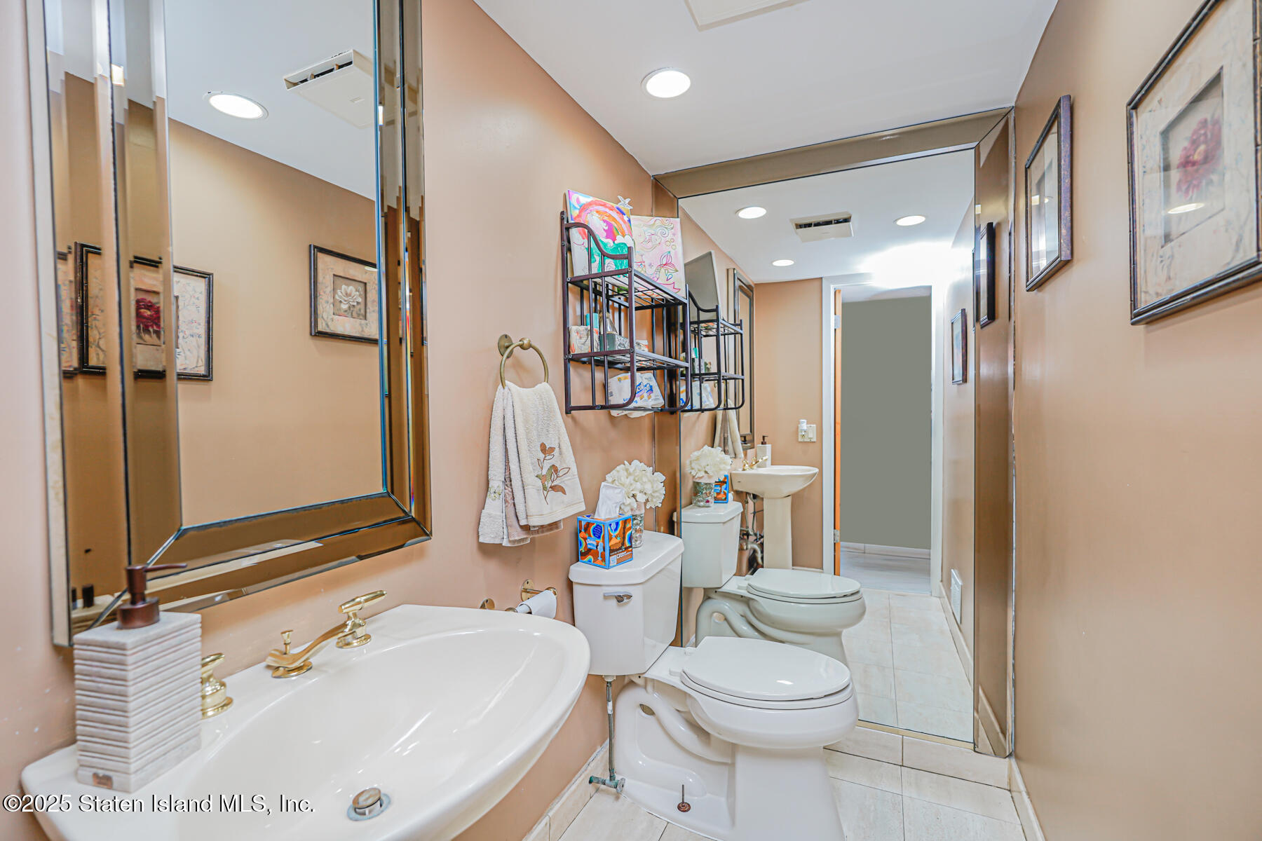 443 Ridgewood Avenue Staten Island, NY 10312 - Photo 20 of 26 a bathroom with a sink toilet and shower