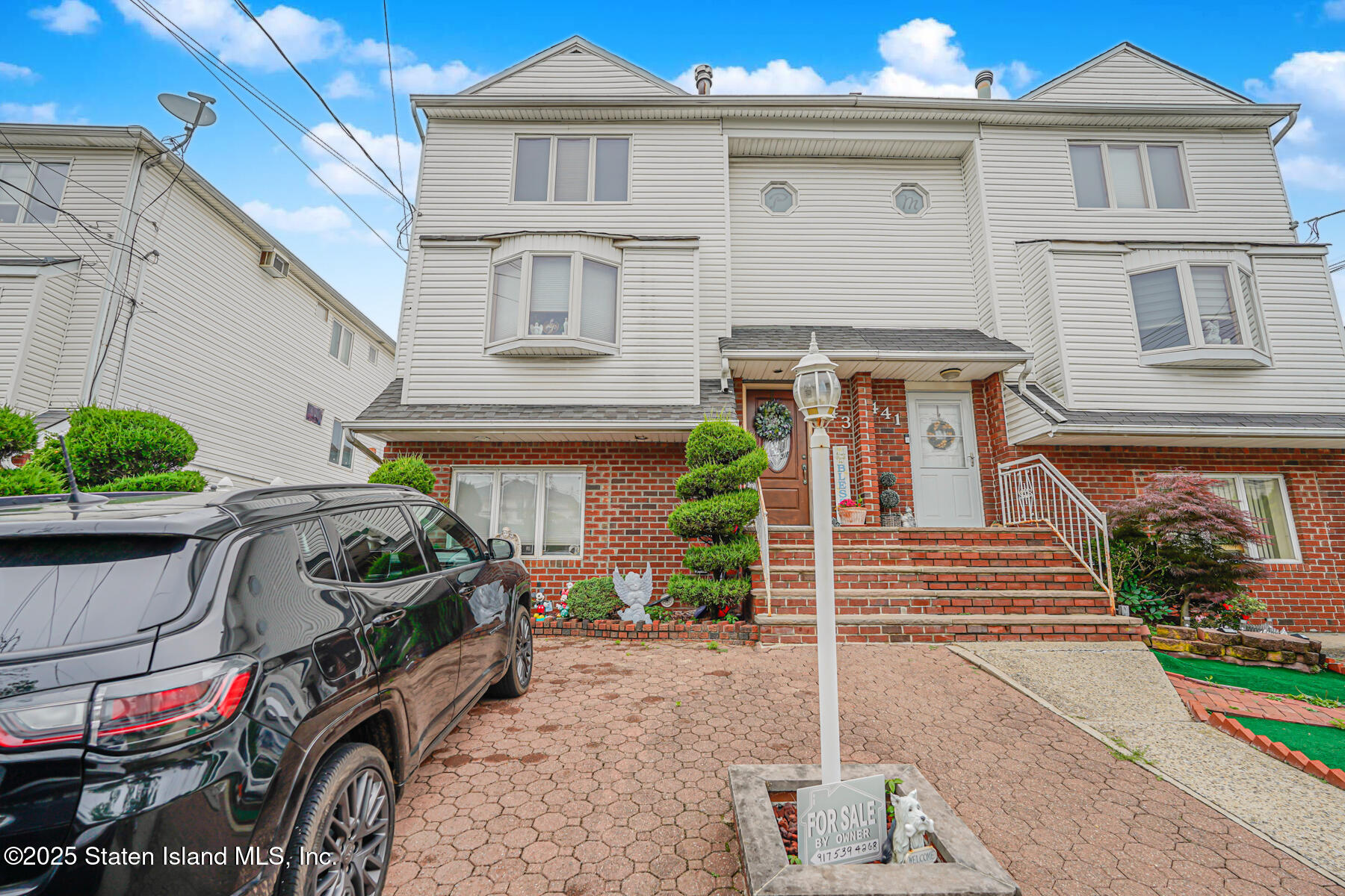 443 Ridgewood Avenue Staten Island, NY 10312 - Photo 2 of 26 a front view of a house with plants