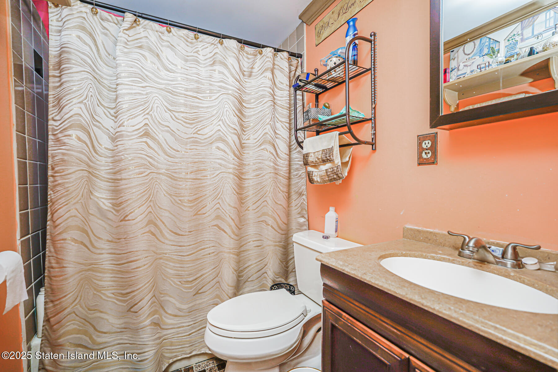 443 Ridgewood Avenue Staten Island, NY 10312 - Photo 22 of 26 a bathroom with a sink toilet and shower