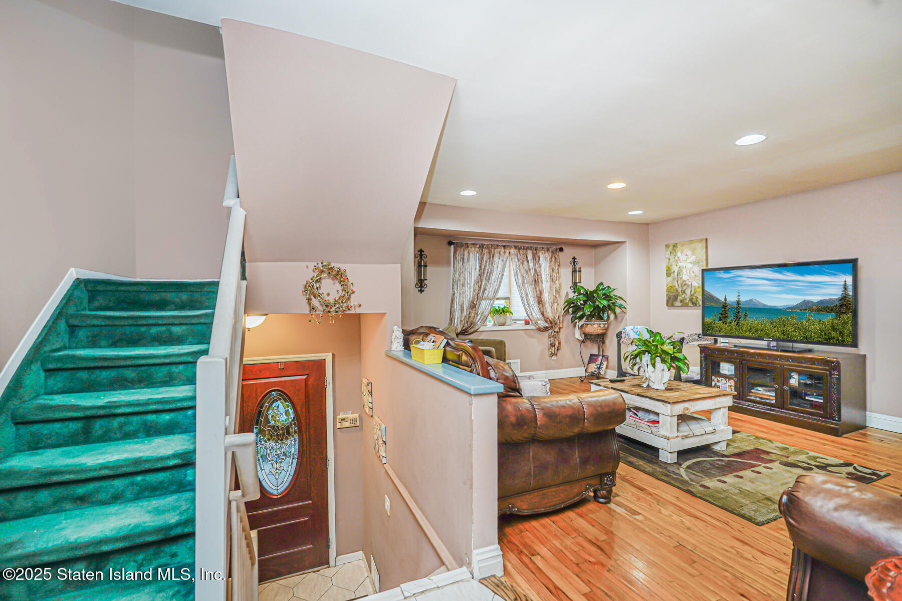 443 Ridgewood Avenue Staten Island, NY 10312 - Photo 3 of 26 a living room with furniture and a flat screen tv