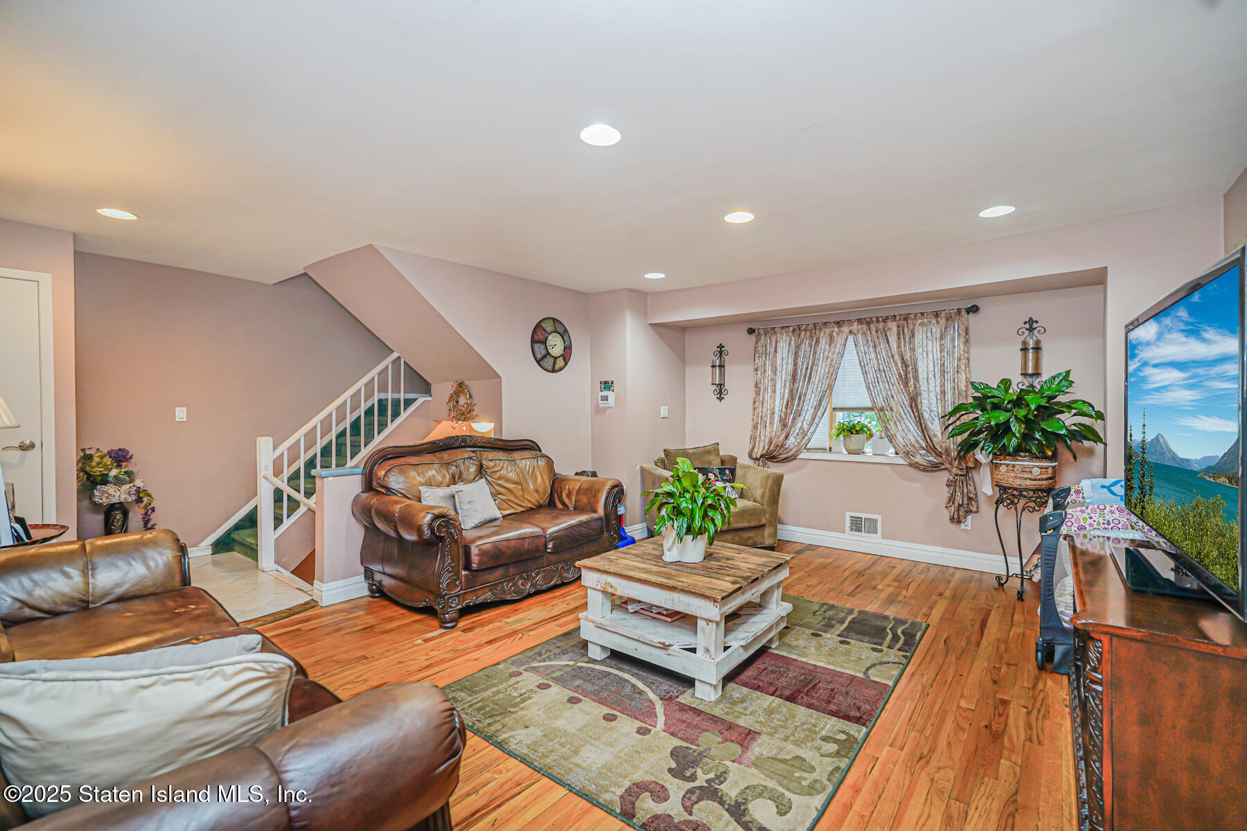 443 Ridgewood Avenue Staten Island, NY 10312 - Photo 4 of 26 a living room with furniture and a wooden floor