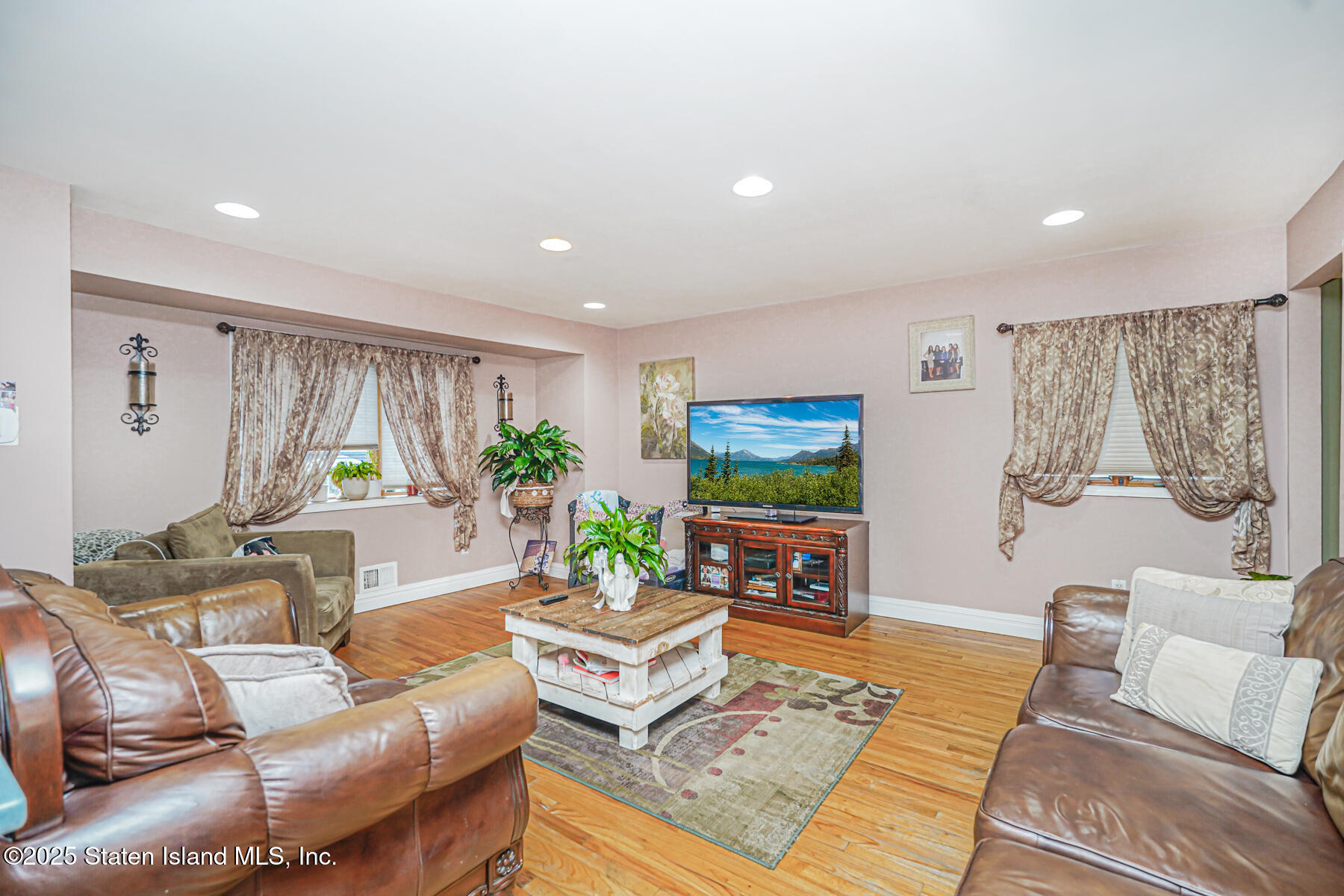 443 Ridgewood Avenue Staten Island, NY 10312 - Photo 5 of 26 a living room with furniture and a flat screen tv