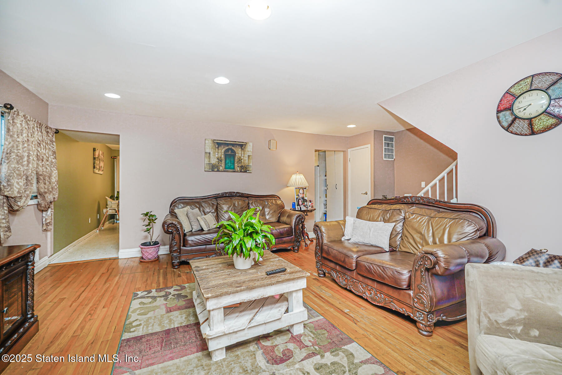 443 Ridgewood Avenue Staten Island, NY 10312 - Photo 6 of 26 a living room with furniture and wooden floor