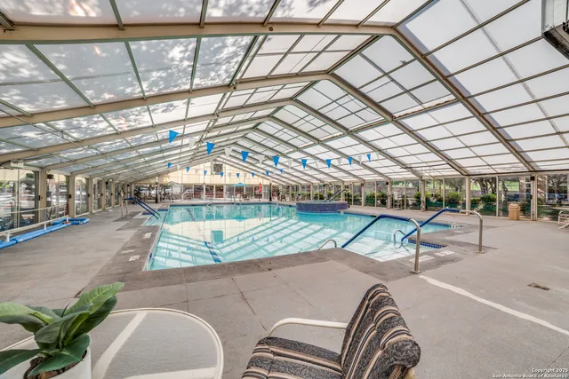 a view of a patio with a table and chairs