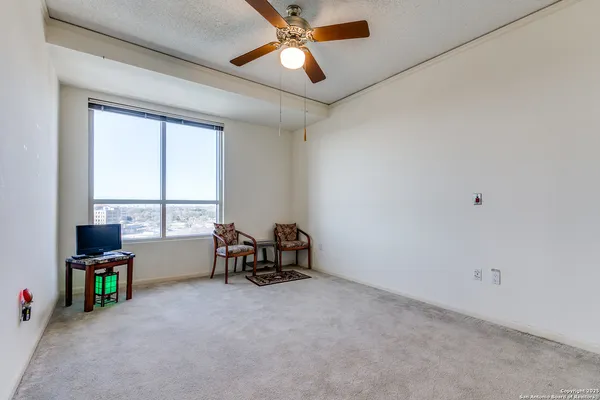 a view of workspace with furniture and window