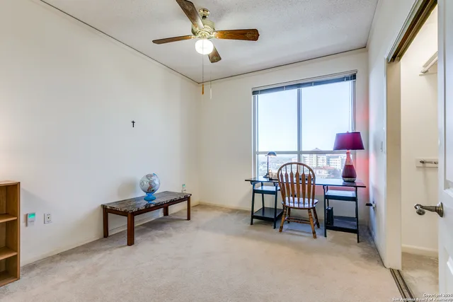 a bedroom with furniture and a window