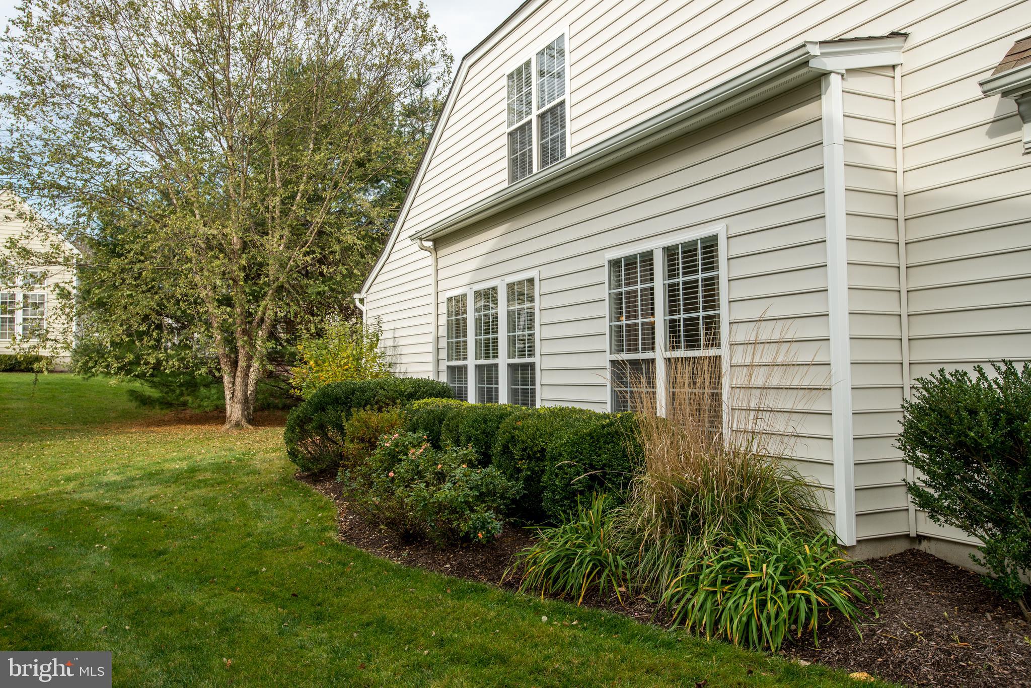305 Aster Circle Kennett Square, PA 19348 - Photo 21 of 26 Side view of home with gorgeous landscaping