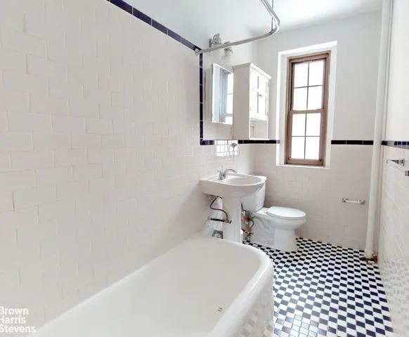 a kitchen with a sink stove top oven and cabinets