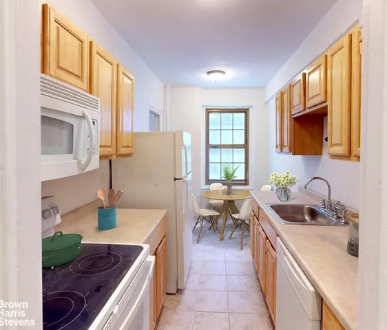 a bedroom with a bed and painting on the wall