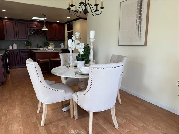 a kitchen with stainless steel appliances granite countertop a sink refrigerator and cabinets