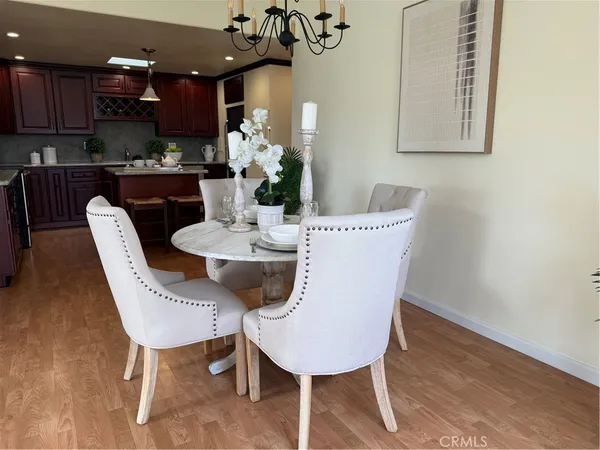 a kitchen with granite countertop wooden cabinets a sink and a oven